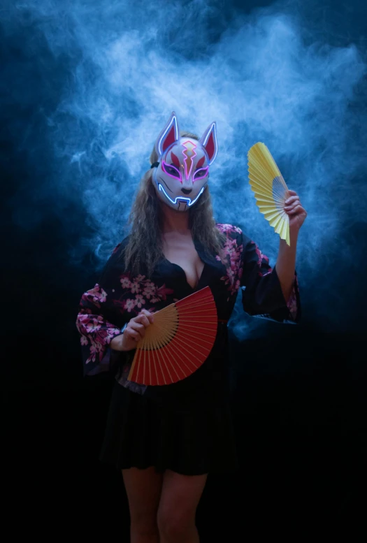 an image of a woman dressed in japanese garb holding two fan