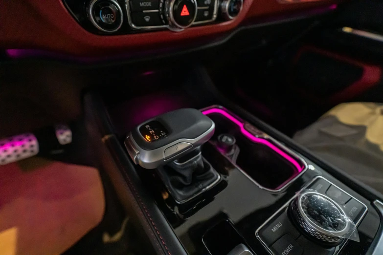an automatic car console and gear controls with leather seat covers