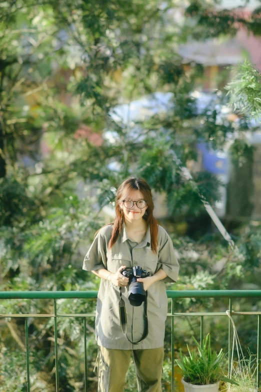 a person is standing and holding a camera