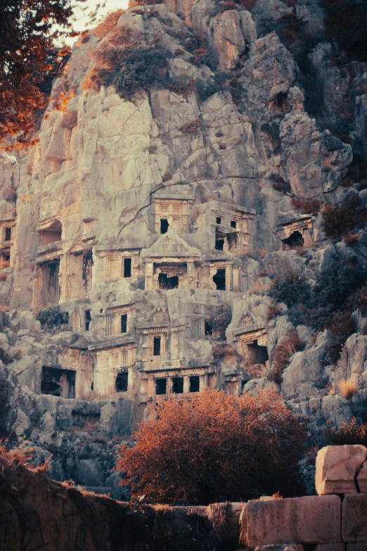 a large rock wall that has some windows