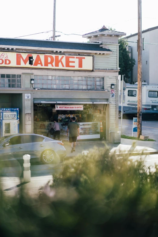 a market with cars parked next to it