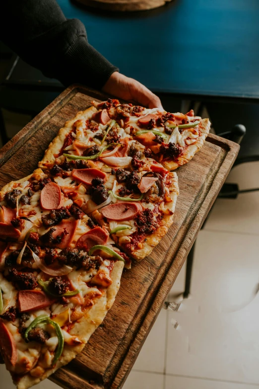 a freshly made pizza sitting on a  board