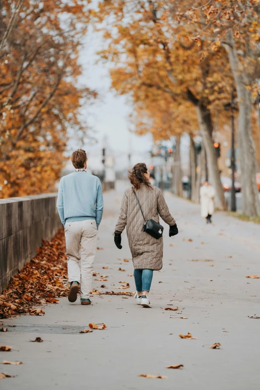 two women walking down the sidewalk together