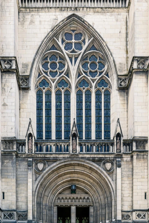 a large, ornate stone church with two very arched windows