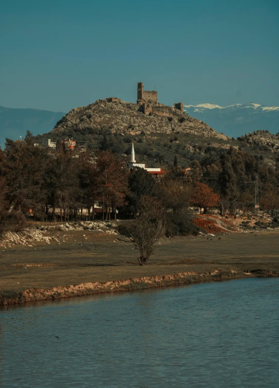 a view of a small mountain with a church on the side