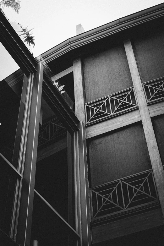 a tall building with balconies next to it