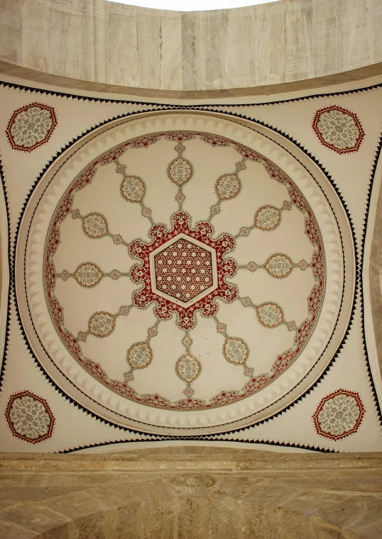 a ceiling has intricate designs on it