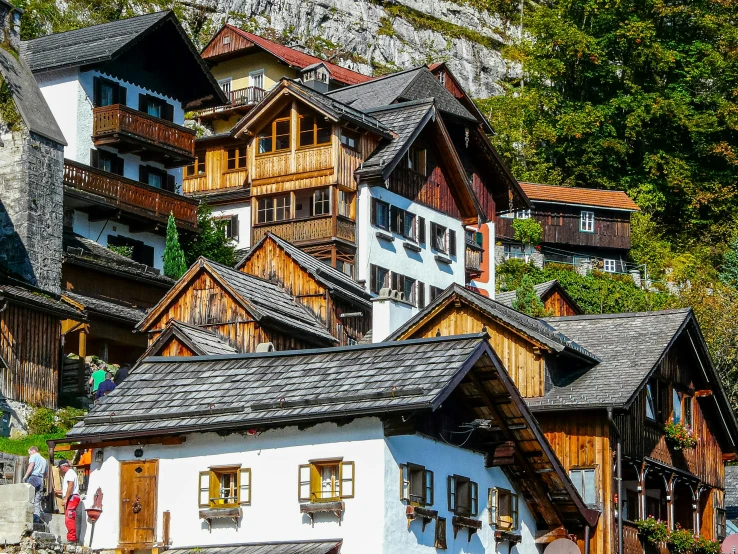old wooden buildings in the mountains near a cliff