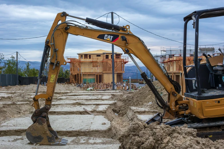 a couple of large machines sitting in the dirt