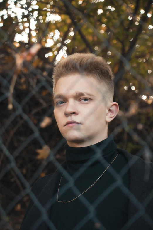 a person with brown hair and a black shirt