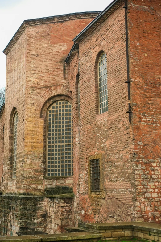 an old brick building with three windows