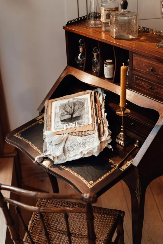 this is a desk with many glass containers and other things