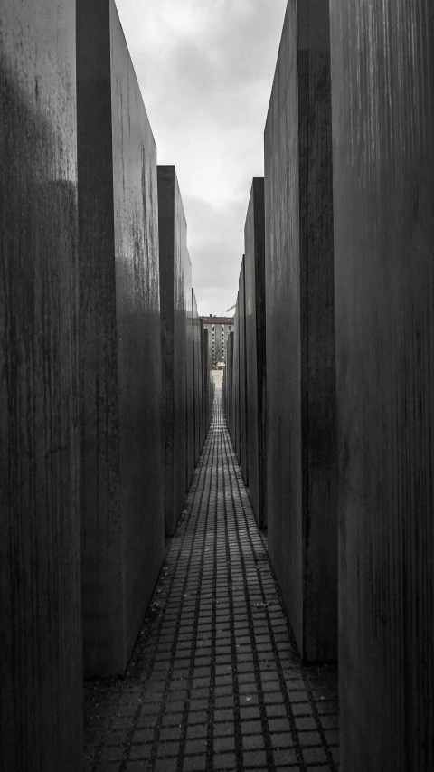 black and white image of the walkway in a tunnel