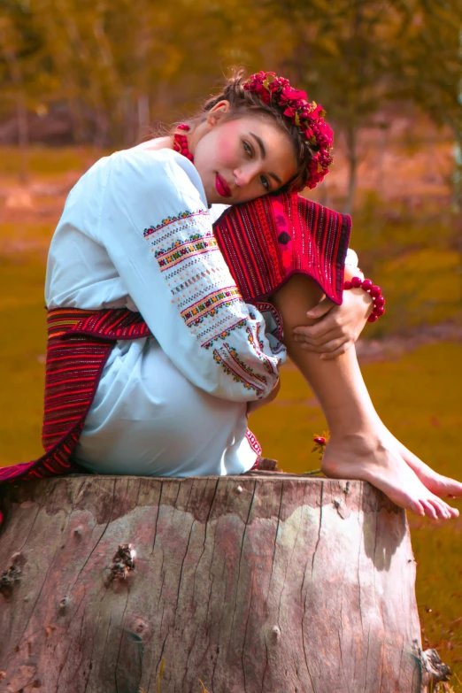 a beautiful young woman wearing red holding a teddy bear