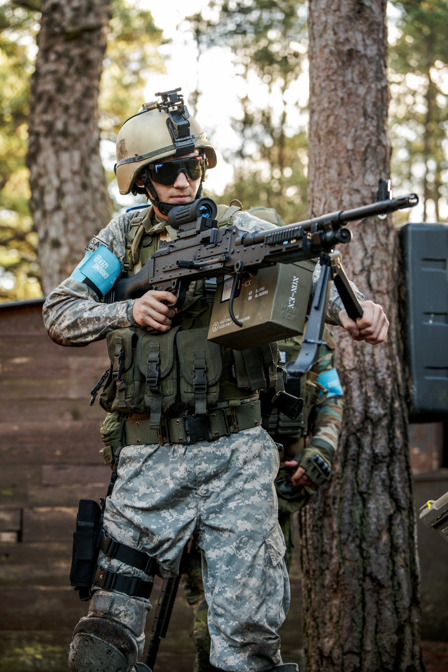 a soldier with a machine gun, and other equipment