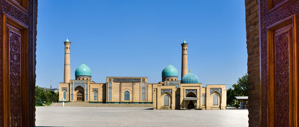 a large building with two blue domes on top