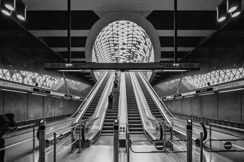 an empty escalator in a building at night