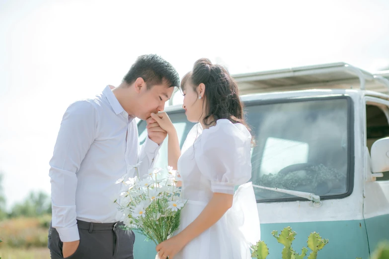 a bride and groom look at each other with love