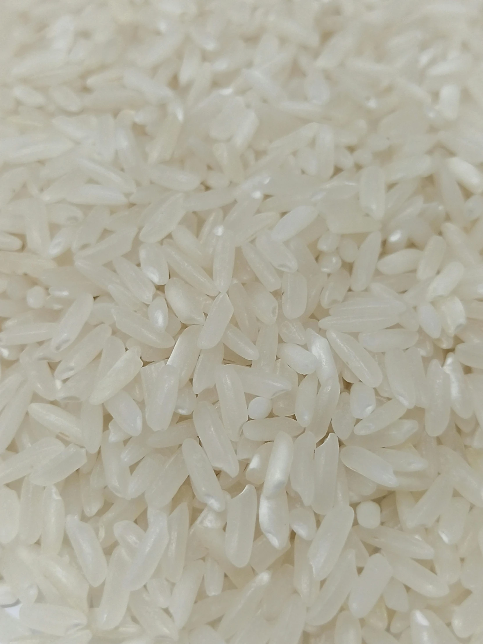 white rice and other food are seen in this closeup image