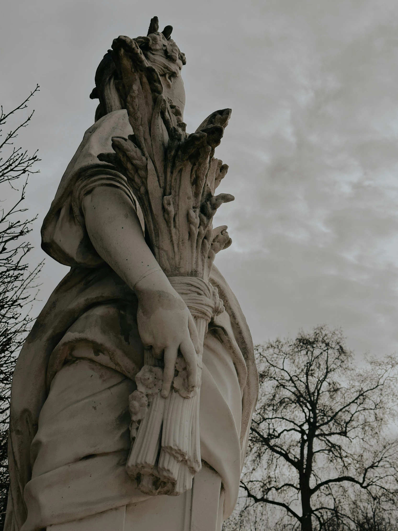 close up of an ancient statue and trees