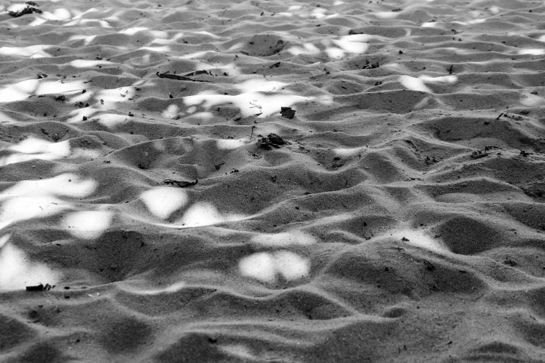 black and white po of sand and clouds