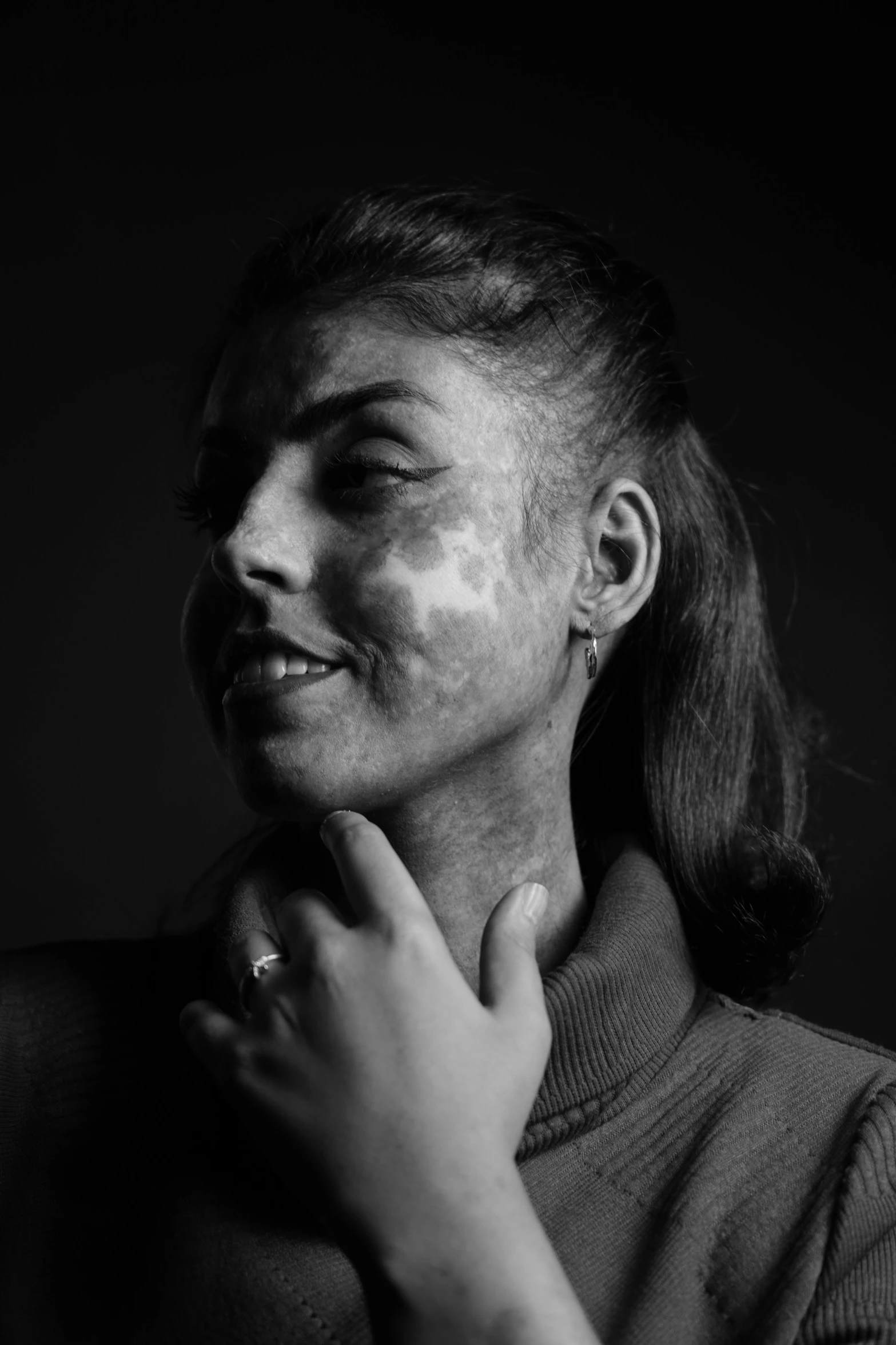 the young woman is rubbing her face with some shavings