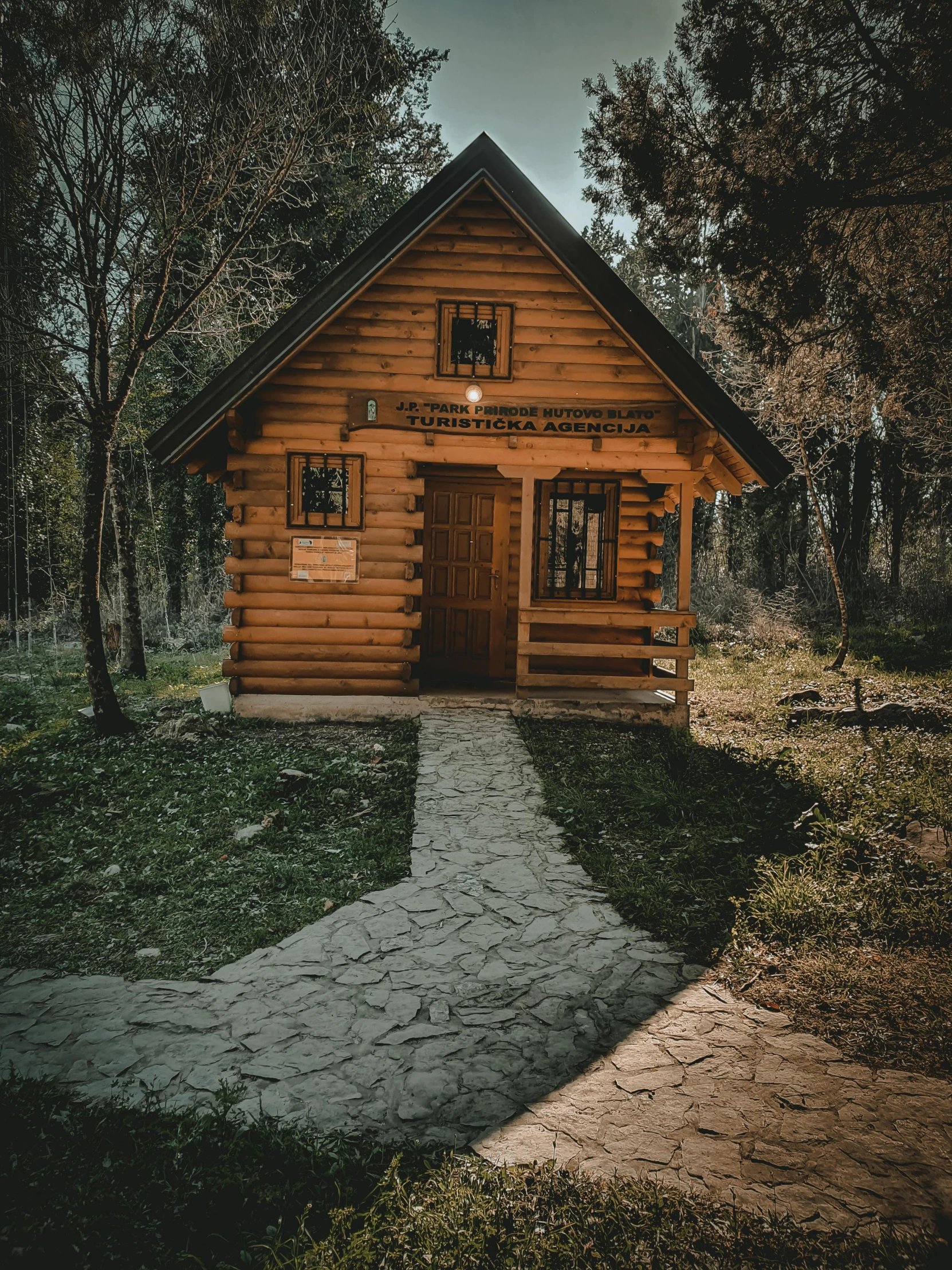 a cabin at twilight on a dark day