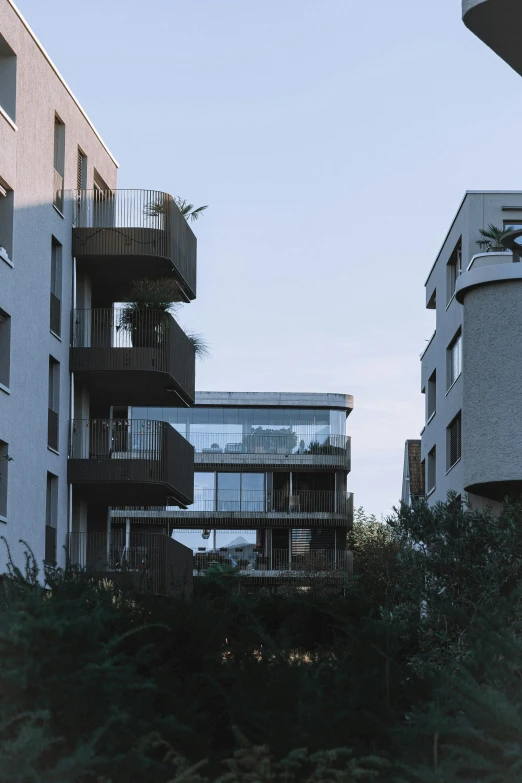 two white buildings with balconies and balconies on them