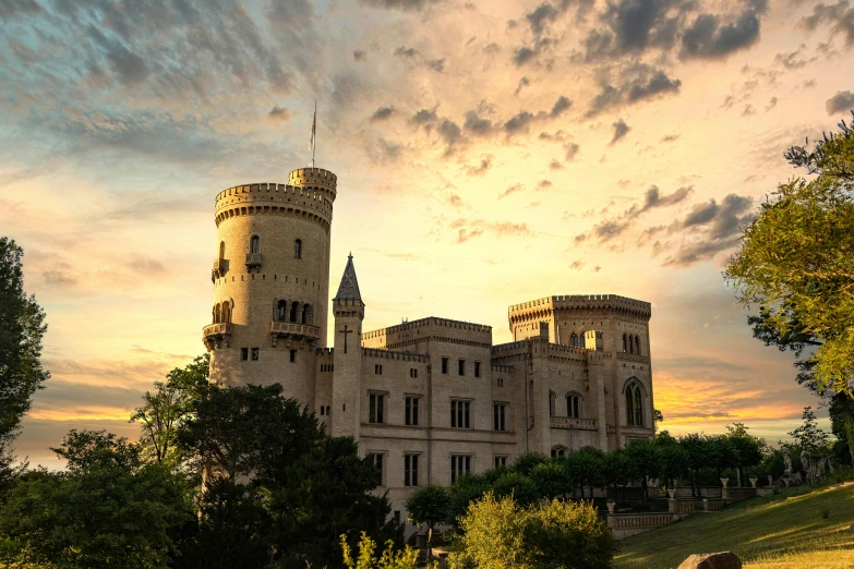 a castle like structure is near a grassy field