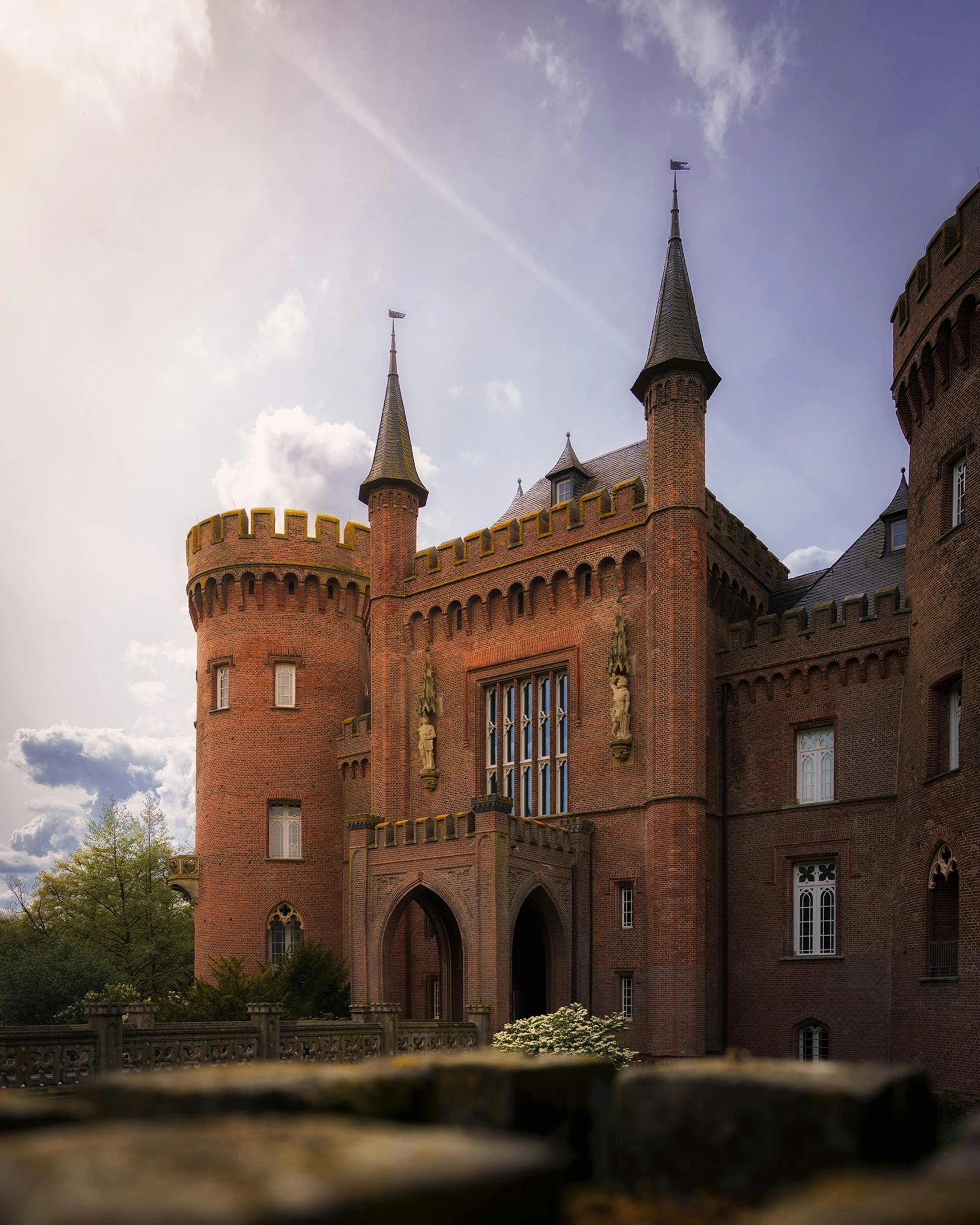 a castle with two towers built into the side of it