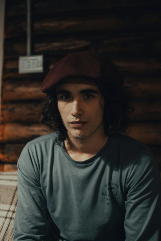 a man wearing a hat poses for the camera