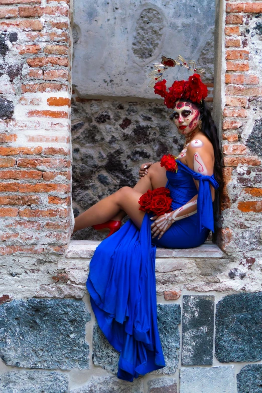 a woman dressed up as a woman wearing red flowers