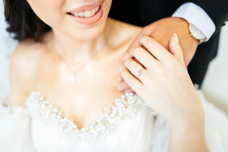 a young asian couple is posing for a po