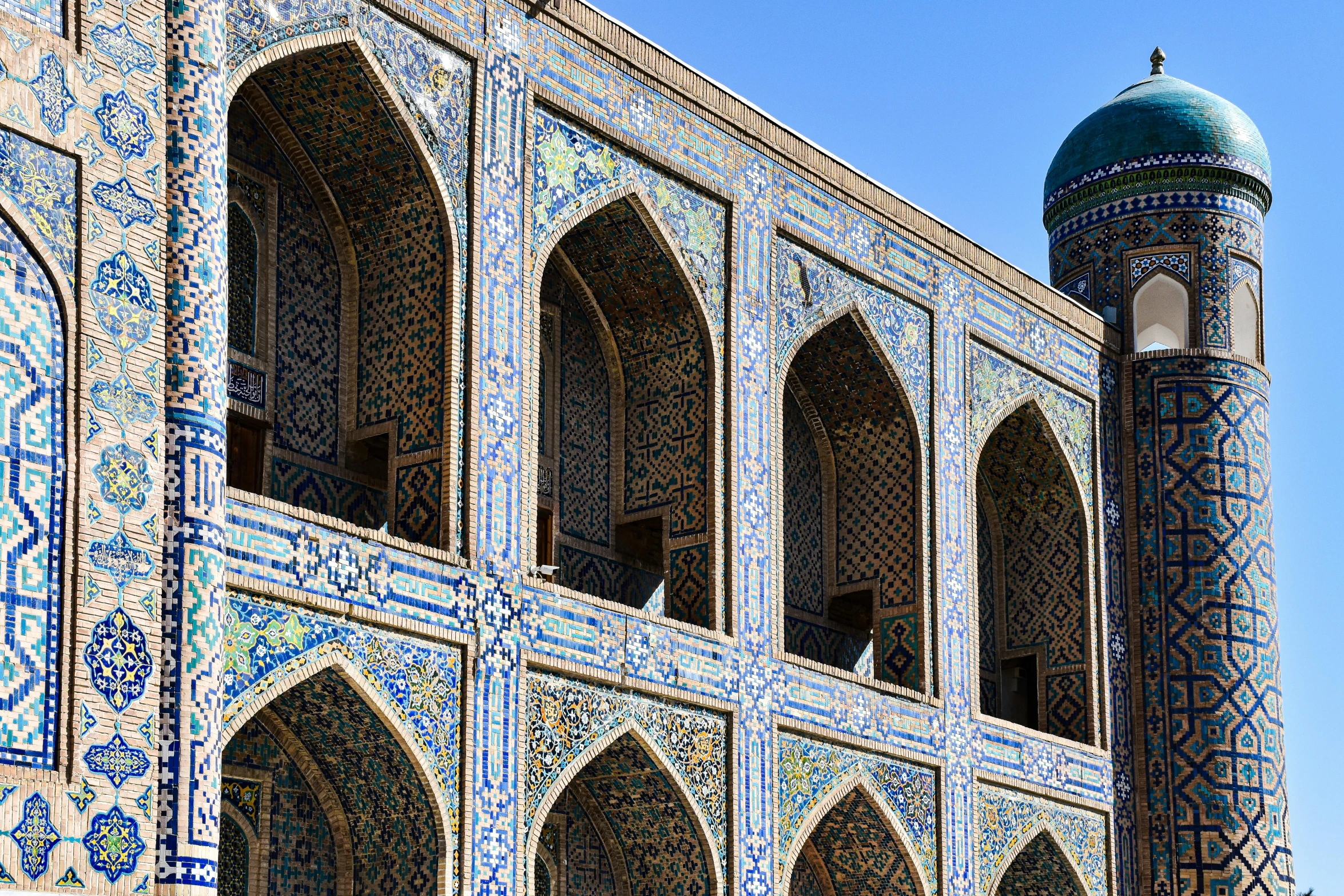 a beautiful blue patterned building with a tower