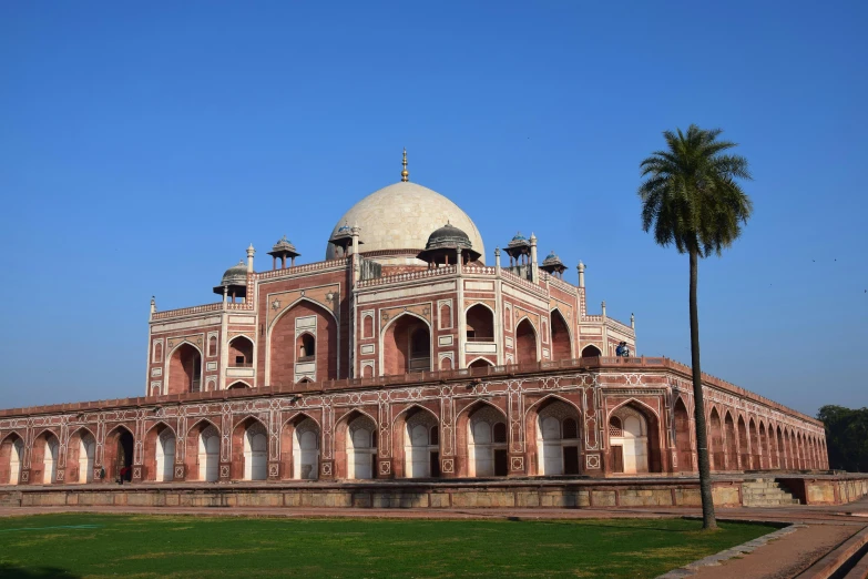 an old brick building with a dome on top