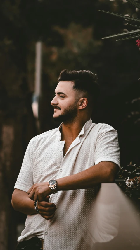 a bearded man with a watch on his wrist