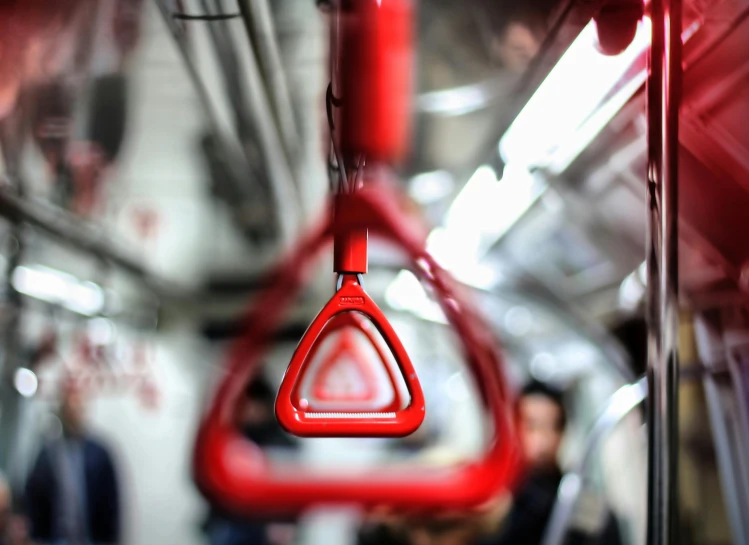 the inside of a red and clear train carriage