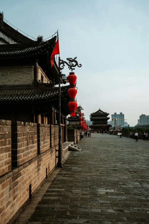 chinese architecture line a cobblestone street