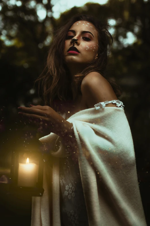 a girl with red lipstick is holding a lantern