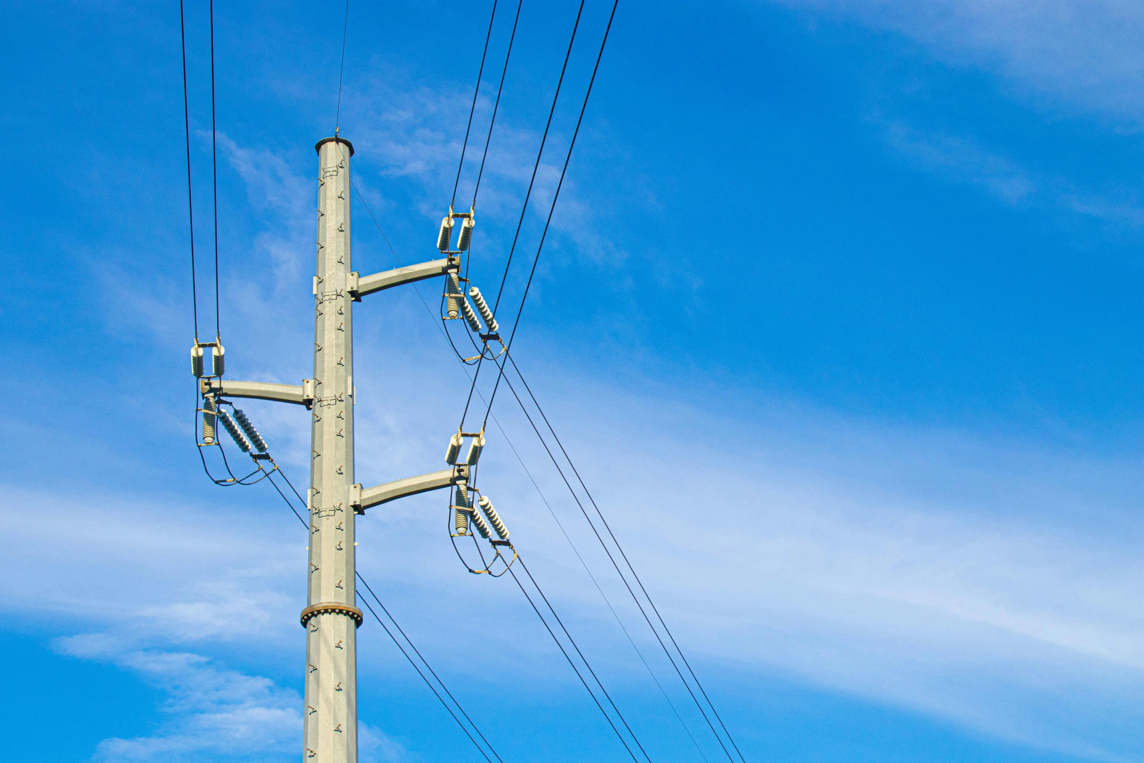 the wires are connected to a telephone pole