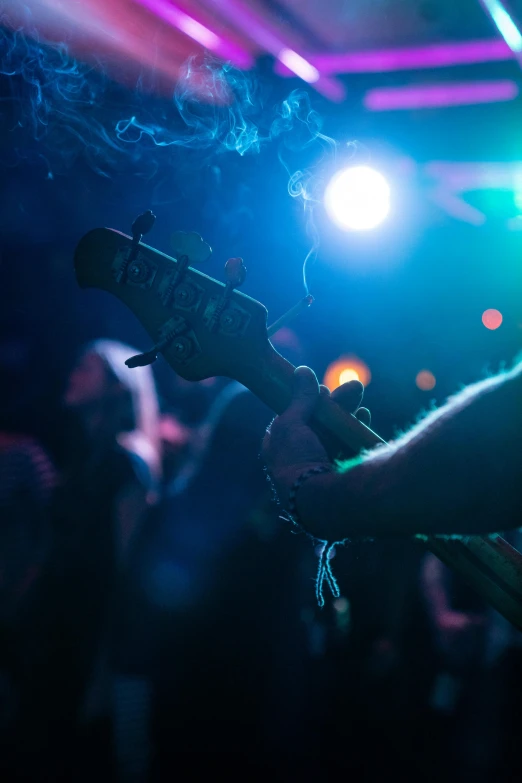 a person that is playing an electric guitar