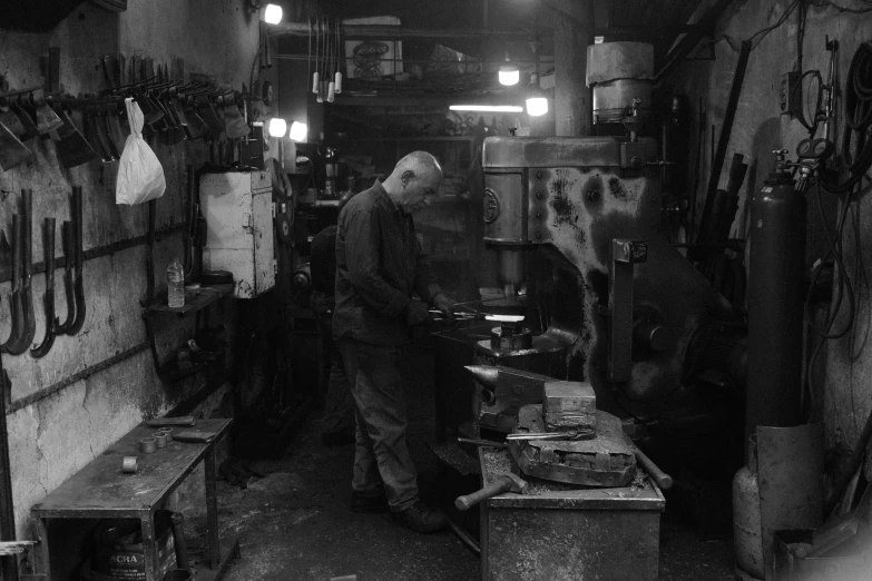 the old man is preparing food in his shop
