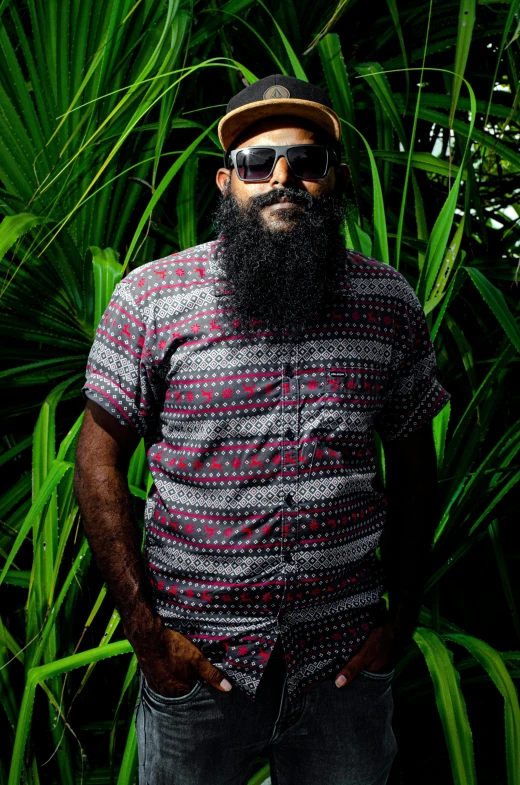 a man with a large beard in sunglasses