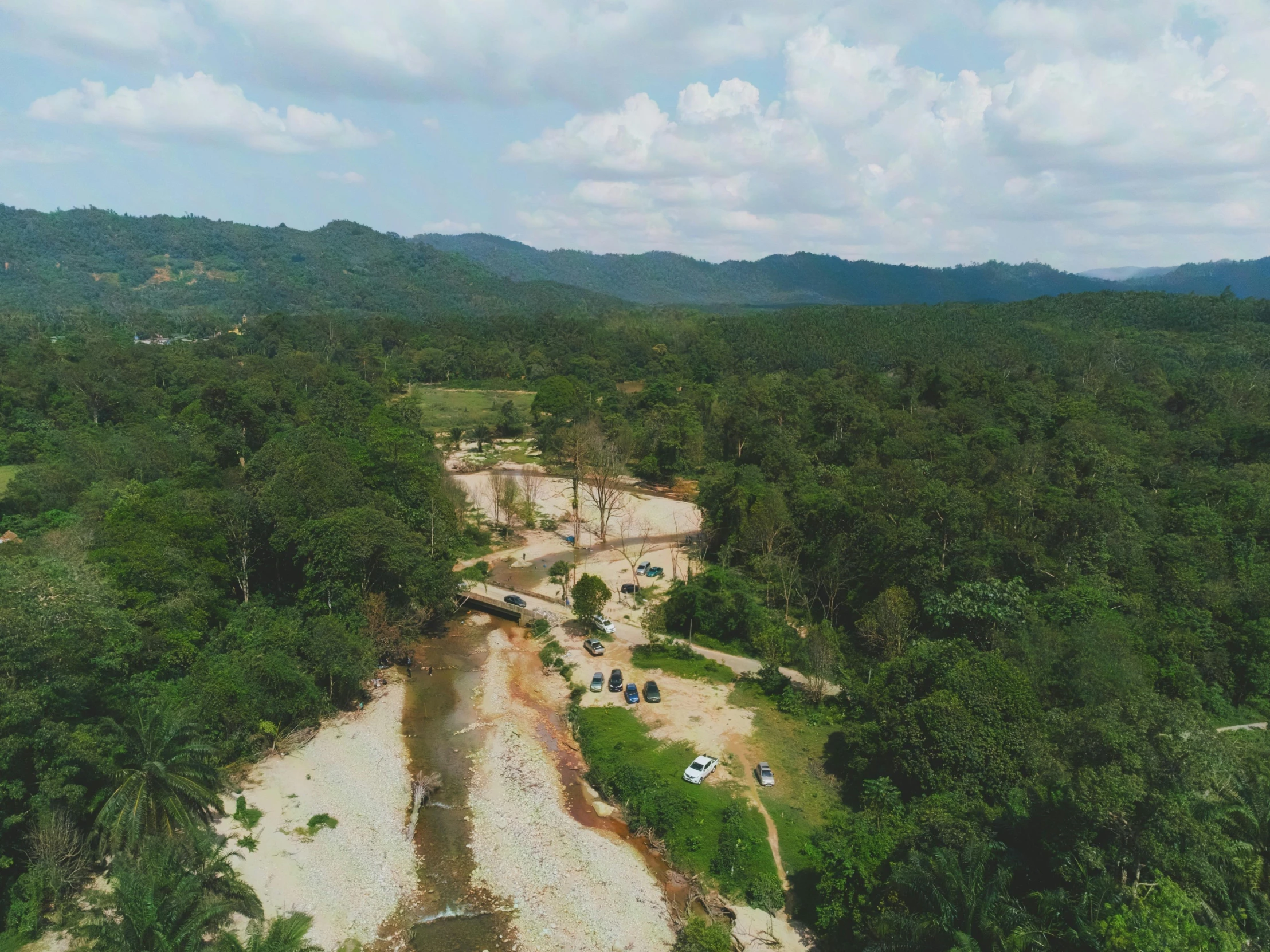 a beautiful beach area that is completely surrounded by greenery