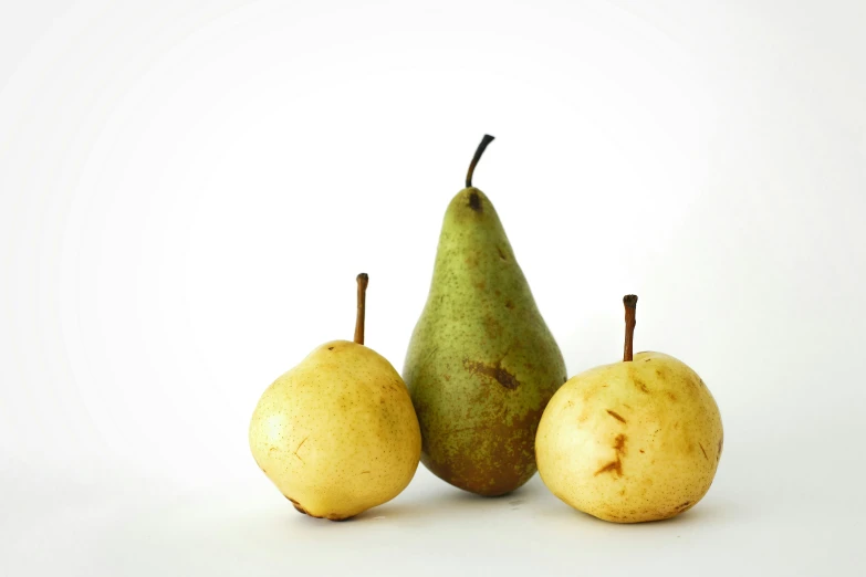 three pears and one pear on white background