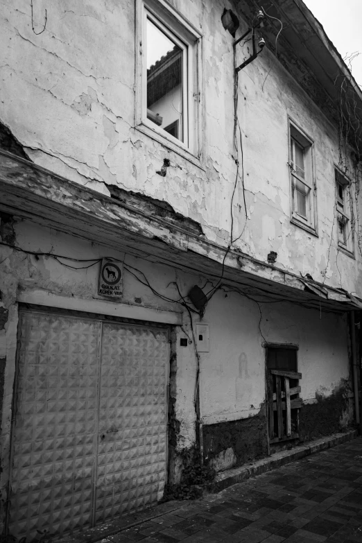 black and white pograph of a dilapidated building