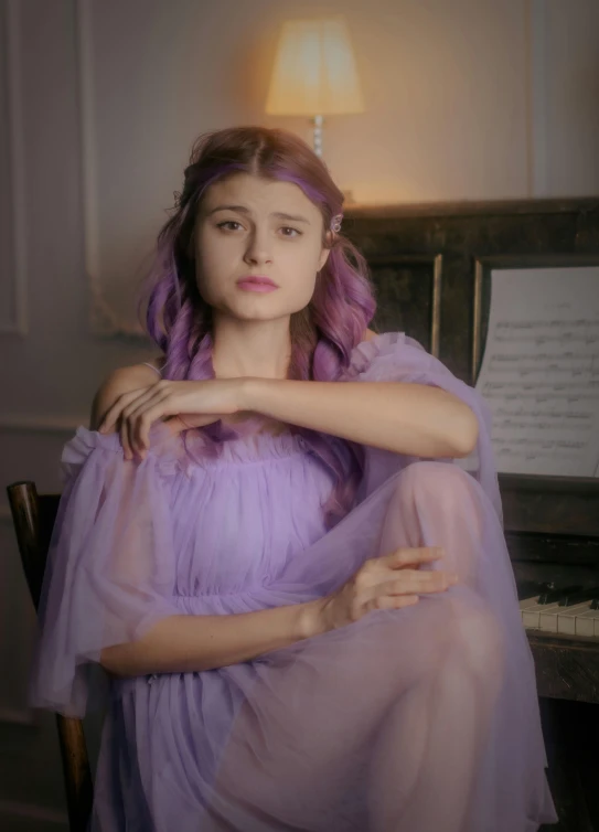 a woman with a purple dress sitting next to a piano