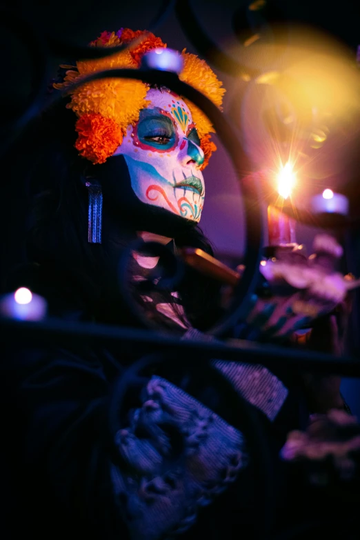 a person wearing a colorful mexican mask and holding a cigarette