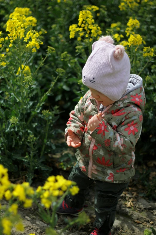 there is a small child standing in a field