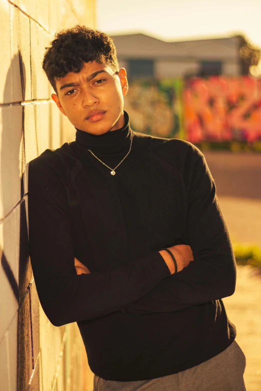 an image of a boy leaning on a wall